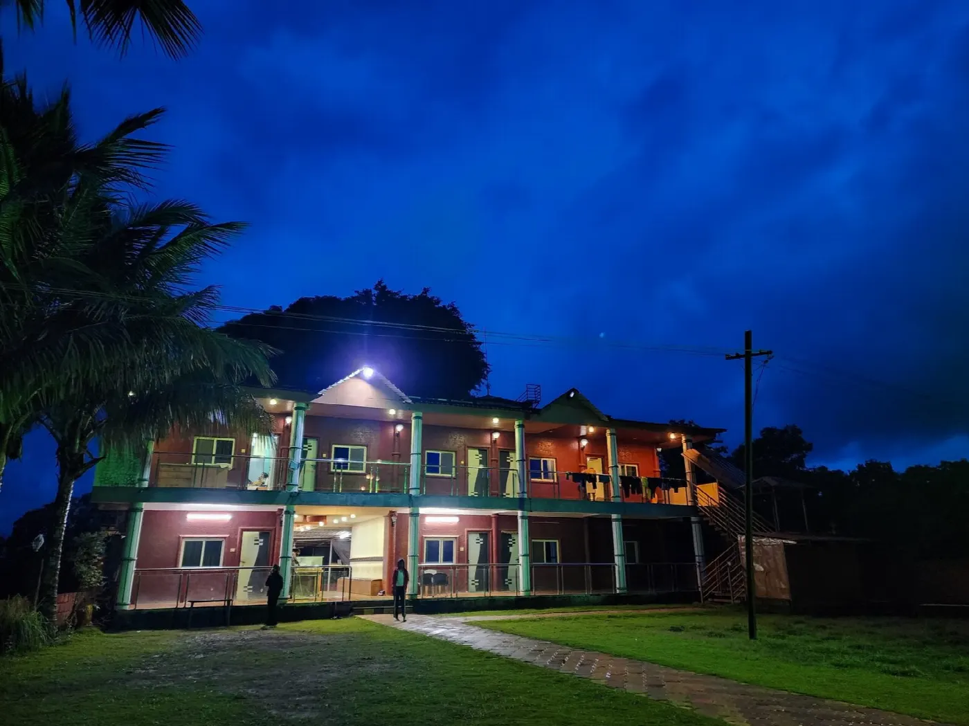 Jalsrushti resort building lit up at dusk